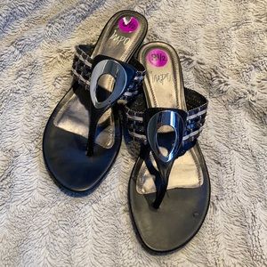 Impo black leather, wedged, thong sandals.